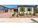 Charming single-story home featuring a well-manicured yard, neutral color palette, and two-car garage at 23769 N 163Rd Dr, Surprise, AZ 85387
