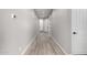 Hallway with light wood floors and neutral walls leads to other rooms at 23769 N 163Rd Dr, Surprise, AZ 85387