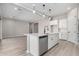 Modern kitchen island with stainless steel dishwasher and sink, perfect for meal prep and entertaining at 23769 N 163Rd Dr, Surprise, AZ 85387