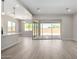 Open-concept living room with large sliding glass doors that bring in natural light at 23769 N 163Rd Dr, Surprise, AZ 85387