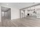Spacious living space with a modern kitchen and ample room for relaxing and entertaining guests at 23769 N 163Rd Dr, Surprise, AZ 85387