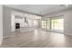 Open-concept living space with a modern kitchen flowing into a bright and airy living area at 23769 N 163Rd Dr, Surprise, AZ 85387