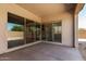 Covered patio with sliding glass doors providing views into the home at 23769 N 163Rd Dr, Surprise, AZ 85387