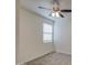 Light-filled bedroom with neutral carpet, a ceiling fan, and a window with bright natural light at 36217 N Urika Dr, San Tan Valley, AZ 85140