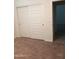 A bedroom featuring a closet with sliding doors and neutral-colored walls at 36217 N Urika Dr, San Tan Valley, AZ 85140