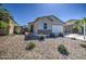 Charming single-story home with a two car garage, stone accents, and low-maintenance landscaping at 36217 N Urika Dr, San Tan Valley, AZ 85140