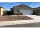 Charming single-story home featuring a neutral color scheme, low-maintenance landscaping, and a convenient two-car garage at 36217 N Urika Dr, San Tan Valley, AZ 85140