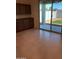 Well-lit room with a door to the backyard, features tile flooring and upper/lower cabinets with granite countertops at 36217 N Urika Dr, San Tan Valley, AZ 85140