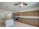 Spacious kitchen featuring a center island, stainless steel appliances, and ample cabinet storage at 36217 N Urika Dr, San Tan Valley, AZ 85140