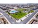 Aerial view of neighborhood, showing pool, basketball court, park, and surrounding houses at 4156 E Bernice St, Gilbert, AZ 85295