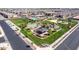 Aerial view of a community park with playground, pool, basketball court, and picnic shelter at 4156 E Bernice St, Gilbert, AZ 85295