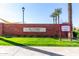 Ira A. Fulton Aquatic Center signage, palm trees, and well-maintained landscaping at the community pool entrance at 4156 E Bernice St, Gilbert, AZ 85295