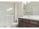 Bathroom with a white shower and a modern vanity with a dark wood finish at 4156 E Bernice St, Gilbert, AZ 85295