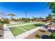 Bocce ball court featuring lush green artificial turf and surrounding landscaping in a well-maintained community at 4156 E Bernice St, Gilbert, AZ 85295