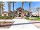 Community clubhouse framed by mature palm trees, featuring a welcoming entrance and manicured landscaping at 4156 E Bernice St, Gilbert, AZ 85295