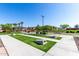 Cornhole area featuring artificial turf with concrete walkways and seating in a Gathering-friendly neighborhood at 4156 E Bernice St, Gilbert, AZ 85295