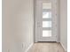 Bright entryway showcasing a modern door with glass panels and light-colored floors at 4156 E Bernice St, Gilbert, AZ 85295