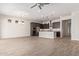 Open-concept living space with a modern kitchen featuring stainless steel appliances and a large island at 4156 E Bernice St, Gilbert, AZ 85295