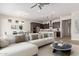 Living room featuring a modern kitchen, dining table, comfortable seating and stylish decor at 4156 E Bernice St, Gilbert, AZ 85295