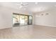 Open-concept living room with large glass sliding doors leading to a covered patio at 4156 E Bernice St, Gilbert, AZ 85295