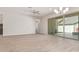 Spacious living room with sliding glass doors to outdoor living space and modern wood-look tile flooring at 4156 E Bernice St, Gilbert, AZ 85295