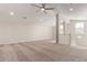 Bright loft area featuring neutral carpet, ceiling fan, and natural light from the window at 4156 E Bernice St, Gilbert, AZ 85295