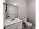 Compact bathroom with white vanity, sink, and toilet at 4613 E Douglas Ave, Gilbert, AZ 85234