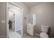 Secondary bathroom with white vanity and toilet at 4613 E Douglas Ave, Gilbert, AZ 85234