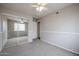 Bedroom features mirrored closet doors, neutral carpet, ceiling fan and a window for light at 4613 E Douglas Ave, Gilbert, AZ 85234