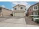 Two-story home with desert landscaping and a two-car garage, located in a quiet neighborhood at 4613 E Douglas Ave, Gilbert, AZ 85234