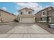 Two-story home features a two-car garage and desert landscaping at 4613 E Douglas Ave, Gilbert, AZ 85234