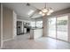 Bright eat-in kitchen features white cabinets, stainless steel appliances, and sliding glass doors to the pool at 4613 E Douglas Ave, Gilbert, AZ 85234