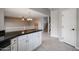 Kitchen island with white cabinets and black countertops at 4613 E Douglas Ave, Gilbert, AZ 85234