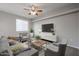 Cozy living room featuring comfortable seating, a ceiling fan, and natural light at 4613 E Douglas Ave, Gilbert, AZ 85234