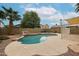 Pool area featuring rock details, desert landscaping, space for entertaining, and a perimeter fence at 4613 E Douglas Ave, Gilbert, AZ 85234