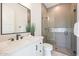 Modern bathroom with a glass-enclosed shower, tiled walls, and a stylish vanity at 610 E Woburn Ln, Phoenix, AZ 85085