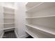 Functional pantry featuring shelving for organized storage, enhancing kitchen efficiency at 610 E Woburn Ln, Phoenix, AZ 85085