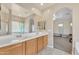 Bathroom features double sinks with tiled floor and large mirrors at 6409 S 49Th Dr, Laveen, AZ 85339