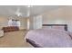 Spacious main bedroom features a seating area, plush carpet, and access to ensuite bathroom at 6409 S 49Th Dr, Laveen, AZ 85339