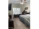 Bedroom features a queen bed, ceiling fan, and bright window providing natural light at 7401 W Arrowhead Clubhouse W Dr # 1015, Glendale, AZ 85308