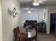 Cozy living room view showcasing a plush leather sofa with accent pillows and an adjacent wooden dining set at 7401 W Arrowhead Clubhouse W Dr # 1015, Glendale, AZ 85308