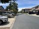 Quiet residential street with parked cars and tidy landscaping at 7401 W Arrowhead Clubhouse W Dr # 1015, Glendale, AZ 85308