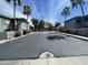 Community entrance featuring lush trees and well-maintained landscaping at 7401 W Arrowhead Clubhouse W Dr # 1015, Glendale, AZ 85308