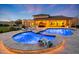 Resort-style backyard with sparkling pool, spa, and covered patio for luxurious outdoor living at 7481 E Camino Santo --, Scottsdale, AZ 85260