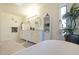 Bright bathroom featuring dual sinks, a luxurious soaking tub, and an elegant chandelier at 7481 E Camino Santo --, Scottsdale, AZ 85260