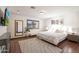 Cozy bedroom featuring a large area rug, mounted television, and wood-look blinds at 7481 E Camino Santo --, Scottsdale, AZ 85260