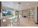 Bright dining nook with a glass table, built-in seating, and custom shelving at 7481 E Camino Santo --, Scottsdale, AZ 85260