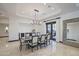 Dining room showcasing marble floors, elegant lighting, and seamless access to an outdoor patio at 7481 E Camino Santo --, Scottsdale, AZ 85260