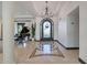 Elegant foyer featuring marble floors, soaring ceilings, and a grand chandelier, complemented by a piano at 7481 E Camino Santo --, Scottsdale, AZ 85260