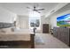 Inviting main bedroom with a ceiling fan, a window seat, and a large television at 7481 E Camino Santo --, Scottsdale, AZ 85260